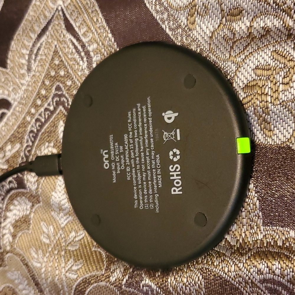 Onn Wireless Phone Charger. Black with mico to USB cord and wall plug